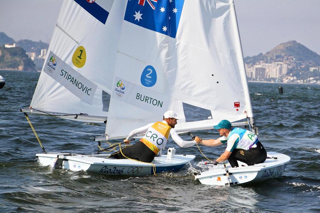 Silver medalist, Tonci Stianovic (CRO) congratulates the Gold medal winner, Tom Burton (AUS)  Mens Laser - 2016 Olympic Regatta © Richard Gladwell www.photosport.co.nz